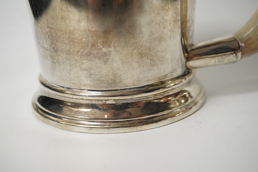 A George VI silver mug with a boar’s tusk handle, Hukin & Heath, Birmingham, 1938, height 11.8cm, gross weight 11.7oz. Condition - fair